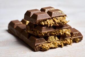 Chocolate bars with gold flakes on top photo