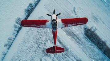 Vintage Airplane Over Snowy Fields photo