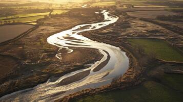 Swollen River in Sunlit Valley photo