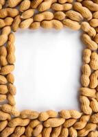 peanuts are arranged in a square frame on a white background photo