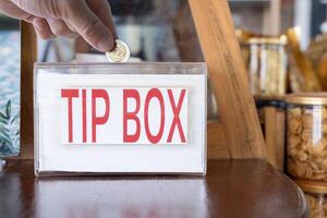 Grateful tourists leave small bills and coins for hotel or restaurant employees. photo