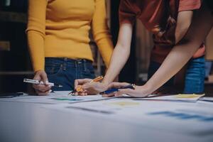 Three people working on a project together photo