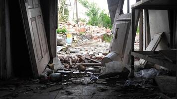 View to destroyed residential buildings at Kharkivska oblast. Ruined houses after bomb attacks on ukrainian territory from russia army. Consequences of russian invasion of Ukraine. Slow motion photo