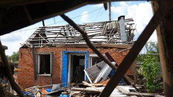 View to destroyed residential buildings at Kharkivska oblast. Ruined houses after bomb attacks on ukrainian territory from russia army. Consequences of russian invasion of Ukraine. Slow motion photo