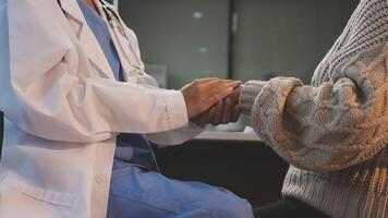 A doctor shaking hands with a patient video