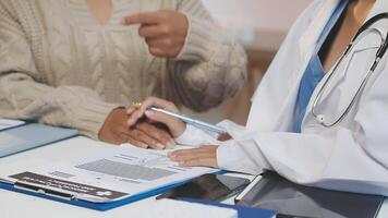 A doctor is talking to a patient video
