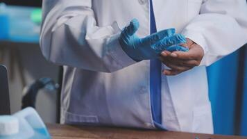 A person in a lab coat and gloves video