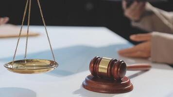 Lawyer and judge on a table with a gavel and scales video