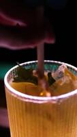 Bartender uses jigger to measure ingredients to create cocktail and pours liquids into shaker closeup slow motion. Professional training for barmen video