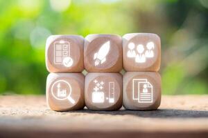 Wooden blocks with business icons symbolizing job interview concepts, teamwork, and professional growth. photo