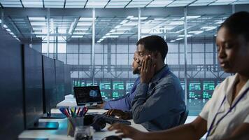 Data center software developer maintaining company network infrastructure by configuring and troubleshooting hardware. Close up of woman in server hub ensuring optimal system performance, camera A photo