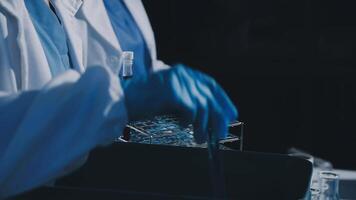 A person in a lab coat is holding a container video