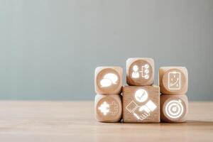 Wooden blocks with negotiation and strategy icons symbolizing business communication and corporate success. photo