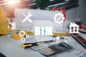 BIM Building Information Modeling Technology concept, Engineer office desk with BIM icon on vr screen, Industry construction, Architect designer. photo