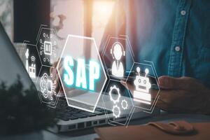 SAP System Software Automation concept, Person hand using smartphone with SAP icon on virtual screen. Business, modern technology, internet and networking concept photo