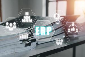 ERP, Enterprise resource planning concept., Business paper on office desk with ERP icon on virtual screen, Document management. photo