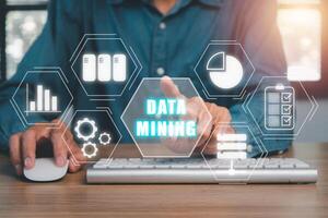Data mining for business and organization, Businessman hand touching data mining icon on VR screen, internet and networking concept. photo
