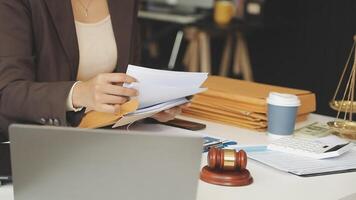 A woman in a business suit is holding a piece of paper video
