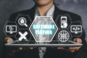Woan hand using tablet with Software Testing inscription icon on VR screen, Business, modern technology, internet and networking concept. photo