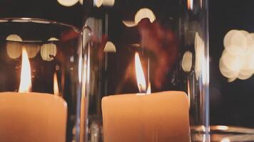 Candles in glass vases with bokeh background video