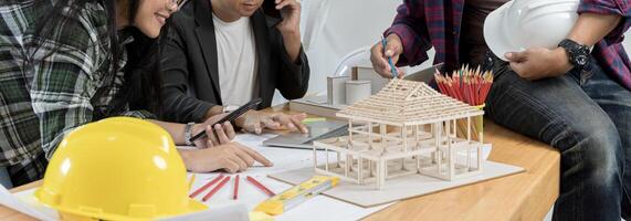 Data working and tablet laptop. Architect explaining project plan to clients. Group of an architect working. photo