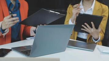 Two business people are working on laptops video