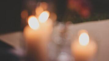 Candles on a table with a blurry background video