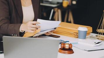 A woman in a business suit is holding a piece of paper video