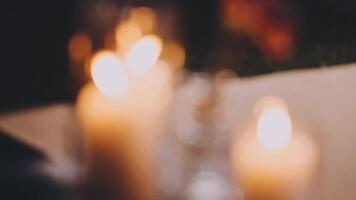 A close up of three lit candles on a table video