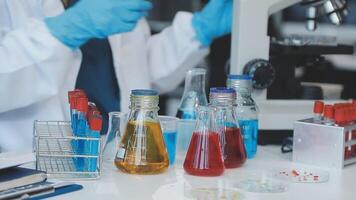 A person in a lab coat is working on a project video