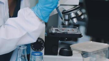 A person in a lab coat is looking at something video