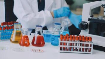 A person in a lab coat is working on a project video