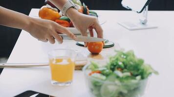 A person cutting vegetables on a table video