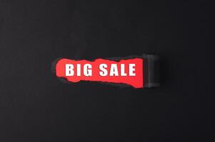 Red sign with the word big sale written on it photo