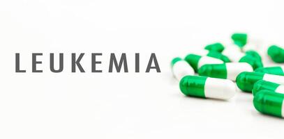 A bunch of pills with the word Leukemia written on them photo