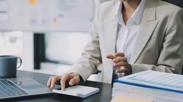 A woman in a business suit is typing on a keyboard video