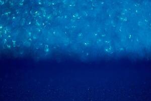 The image is a blue background with a lot of small blue dots photo