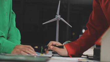 Two people working on a wind turbine video