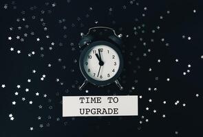 Black and white photo of a clock with the words Time to Upgrade
