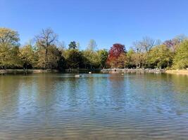 A lake with a few people in the background photo