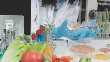 A woman in a lab coat is holding a bowl of food video