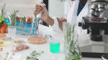 A woman in a lab coat is working on a project video