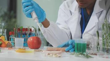 A woman in a lab coat is working on a project video