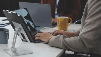 A person typing on a laptop computer video