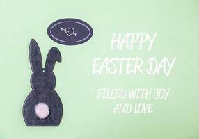 text congratulations for easter with a hare on a green background photo