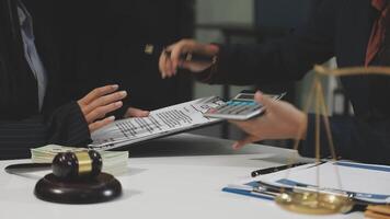 Two business people are working on a document video
