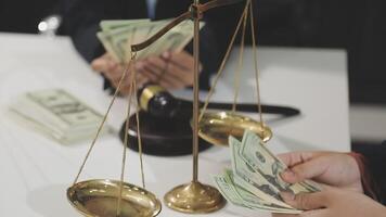 A man holding money and a scale with a judge video