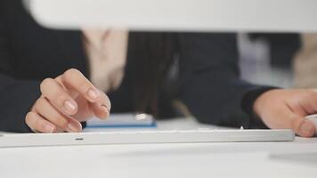 A person is typing on a computer keyboard video
