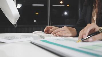A person is typing on a keyboard and using a pen video