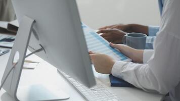 A person is using a computer and a tablet video